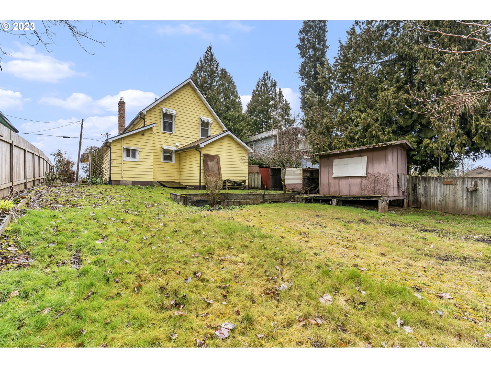 108 South 4th Avenue Ridgefield, WA 98642 - Photo 27 of 32 a front view of a house with a garden and yard