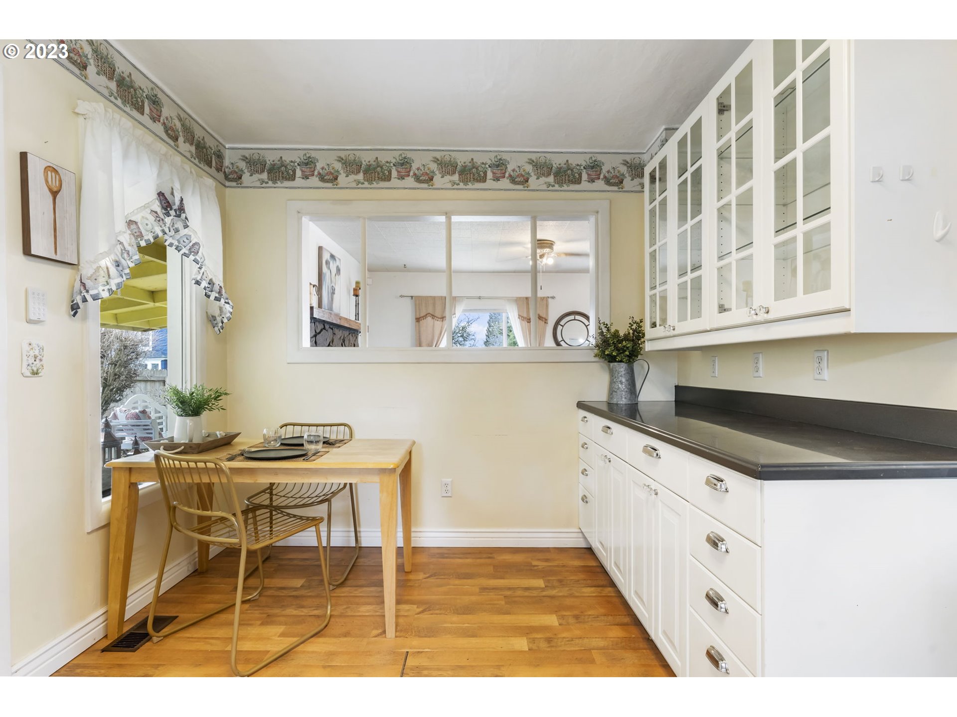 108 South 4th Avenue Ridgefield, WA 98642 - Photo 8 of 32 a kitchen with granite countertop a sink cabinets and window