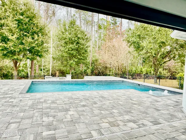 a view of backyard with green space