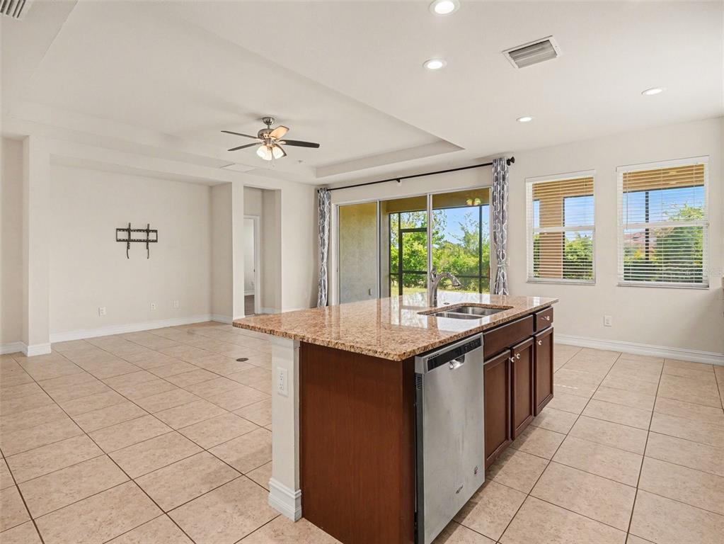 4429 Conchfish Lane Osprey, FL 34229 - Photo 5 of 20 a kitchen with stainless steel appliances granite countertop a sink and a stove