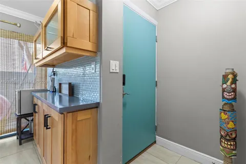 a bathroom with a sink a toilet and a window