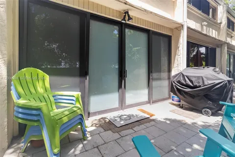 a view of a two chairs in the patio