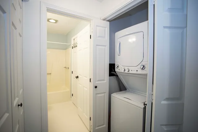 a view of bathroom with a washer and dryer