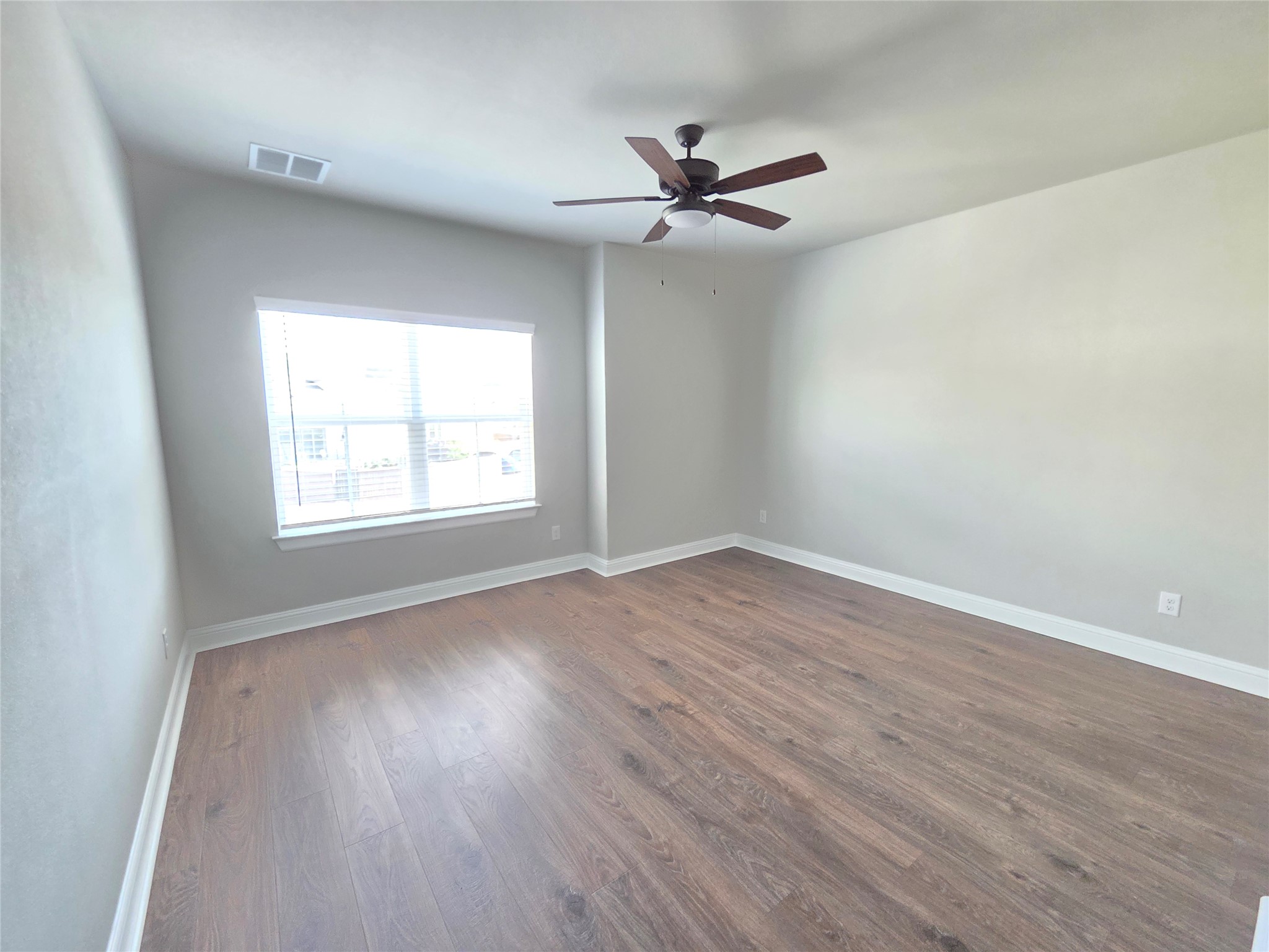 600 C-Bar Ranch Trail, Unit 121 Cedar Park, TX 78613 - Photo 23 of 32 A quiet bedroom retreat with wood-look flooring and ample natural illumination.