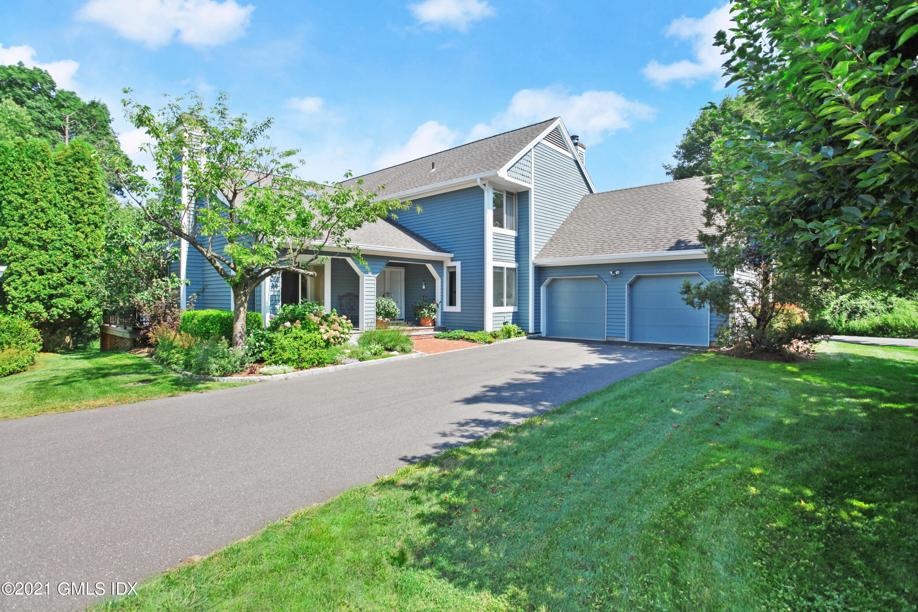 22 Farm Hill Road Stamford, CT 06902 - Photo 1 of 1 a front view of a house with a yard and garage