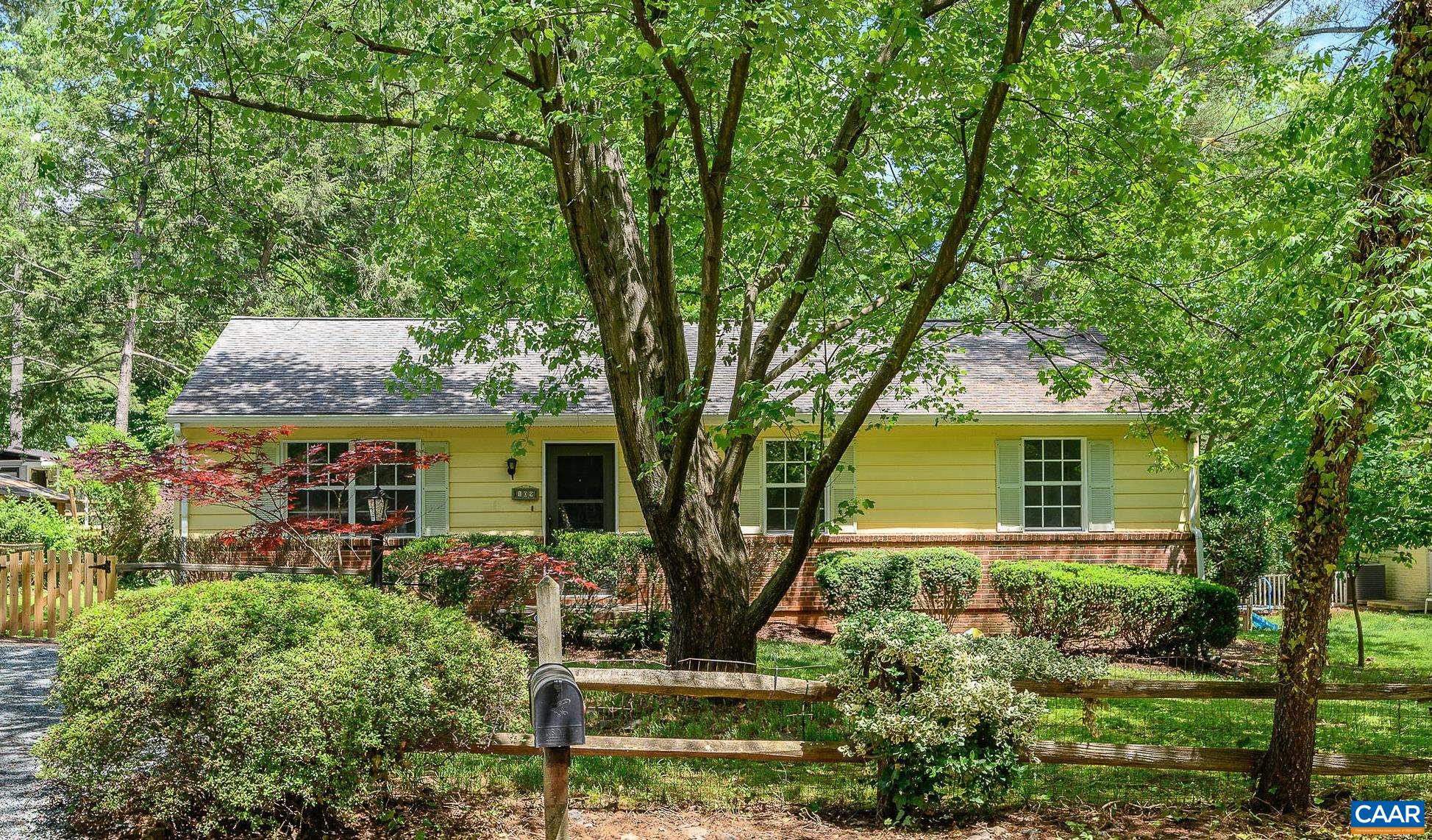 front view of a house with a tree