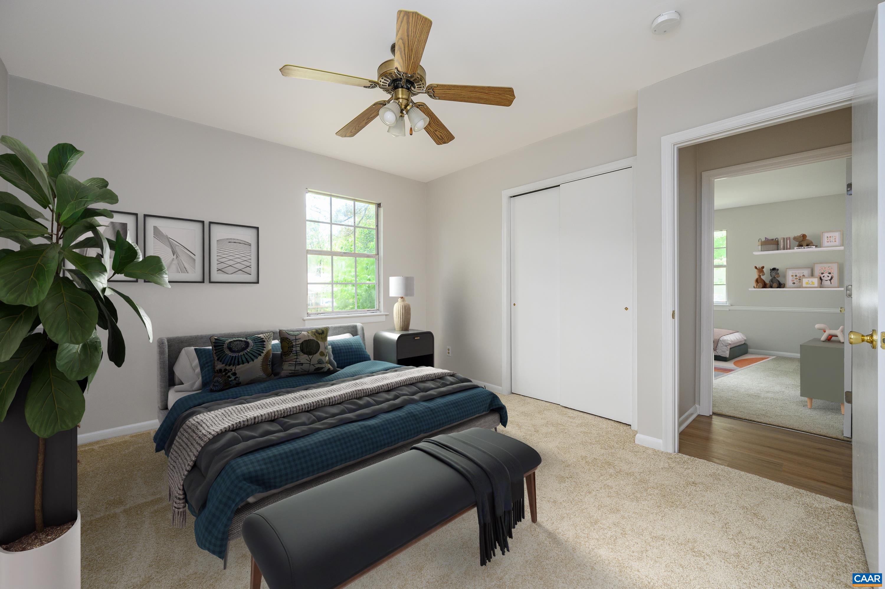 109 Middlesex Drive Charlottesville, VA 22901 - Photo 14 of 27 a bedroom with a bed and a chandelier