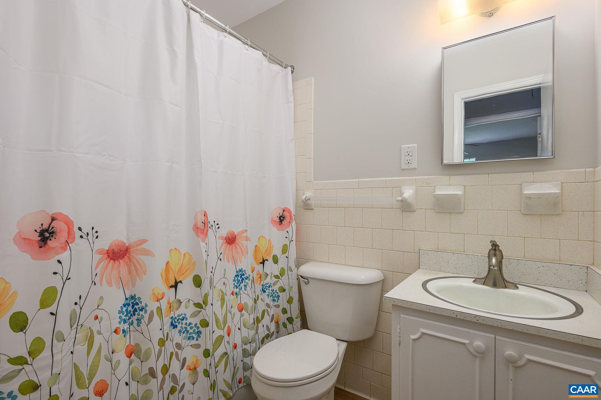109 Middlesex Drive Charlottesville, VA 22901 - Photo 17 of 27 a white toilet sitting next to a bathroom sink