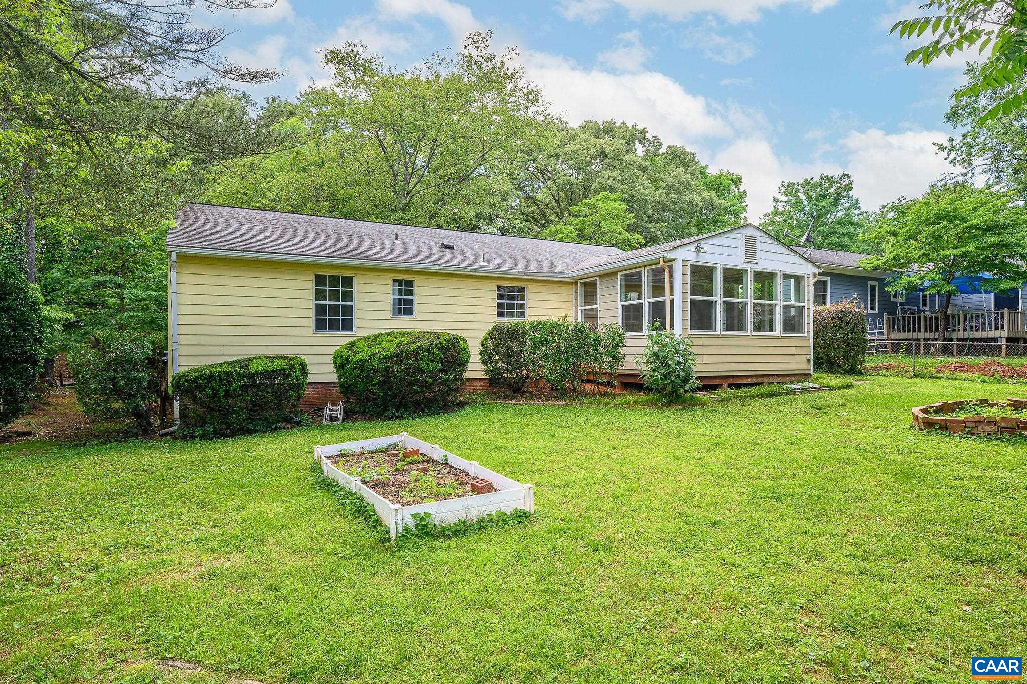 109 Middlesex Drive Charlottesville, VA 22901 - Photo 21 of 27 a view of a house with a backyard and a garden