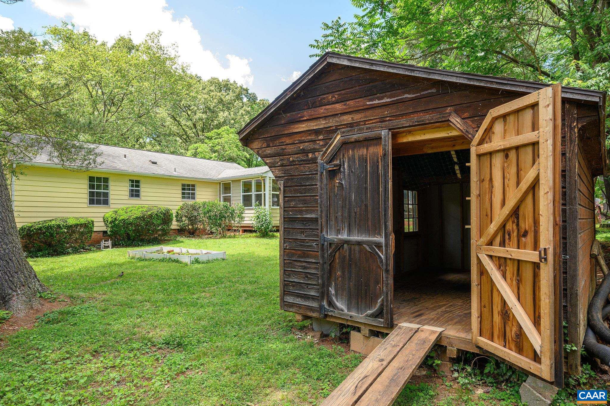 109 Middlesex Drive Charlottesville, VA 22901 - Photo 24 of 27 a view of backyard with deck and garden