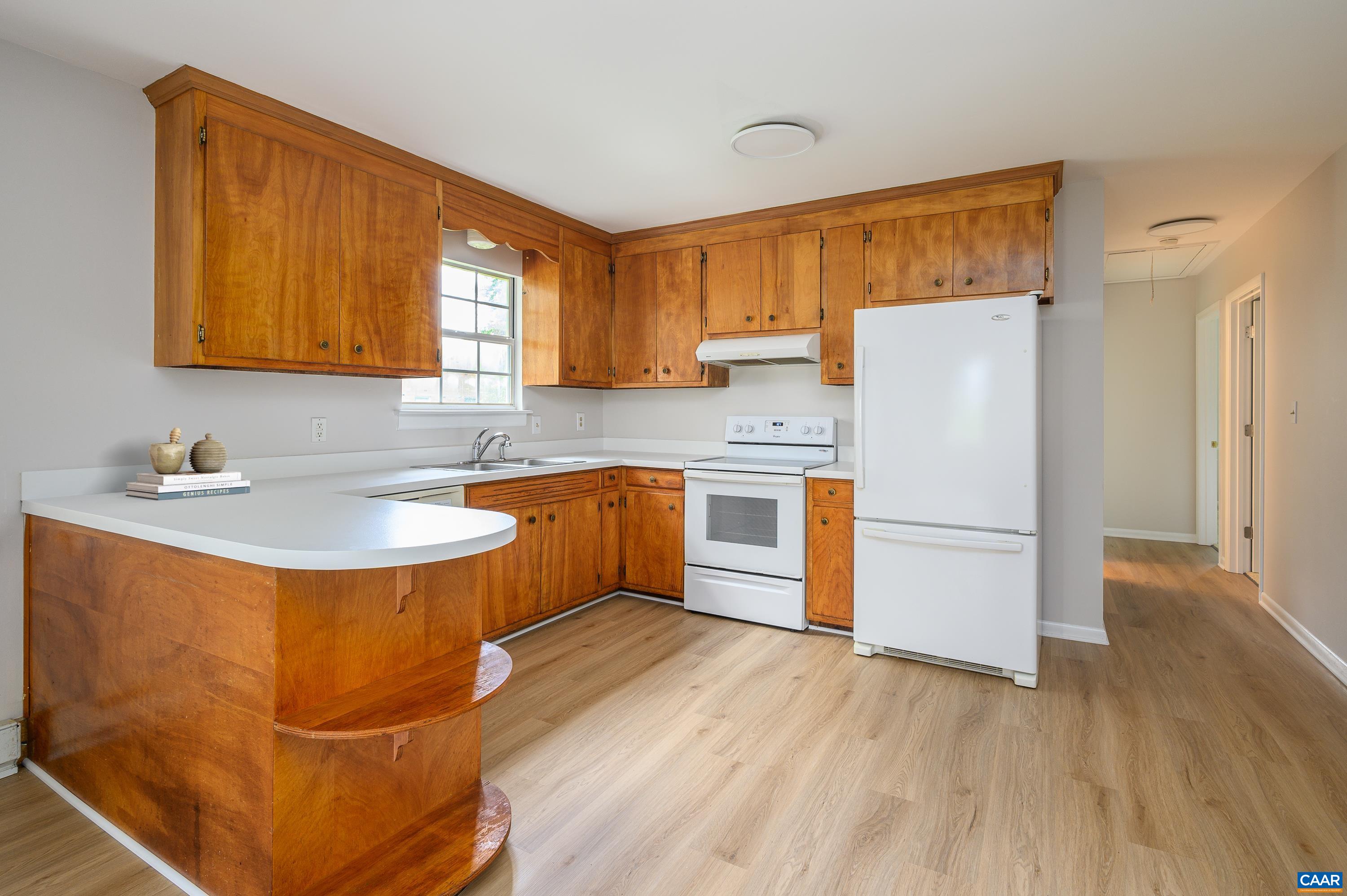 109 Middlesex Drive Charlottesville, VA 22901 - Photo 7 of 27 a kitchen with stainless steel appliances granite countertop a sink stove and refrigerator