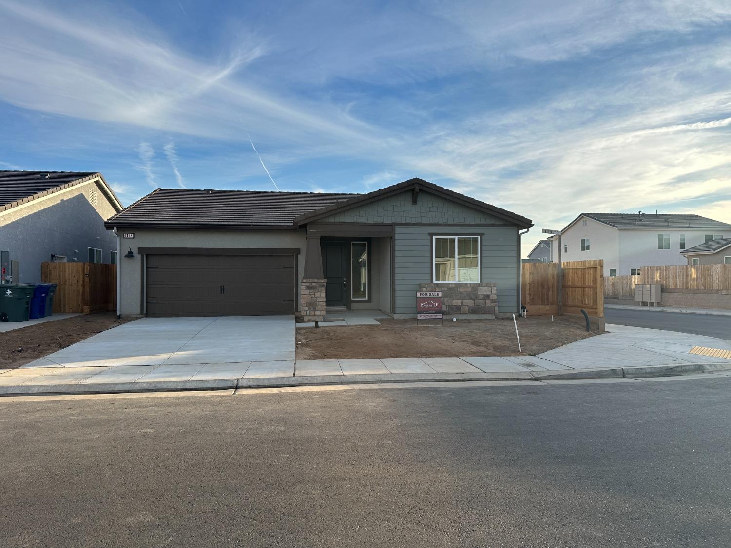 4178 Beverly Avenue Clovis, CA 93619 - Photo 1 of 4 a view of a house with a yard and garage