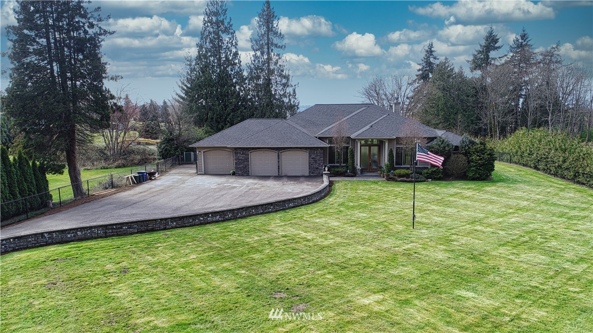 4830 Fobes Road Snohomish, WA 98290 - Photo 2 of 35 a view of a house with backyard and trees