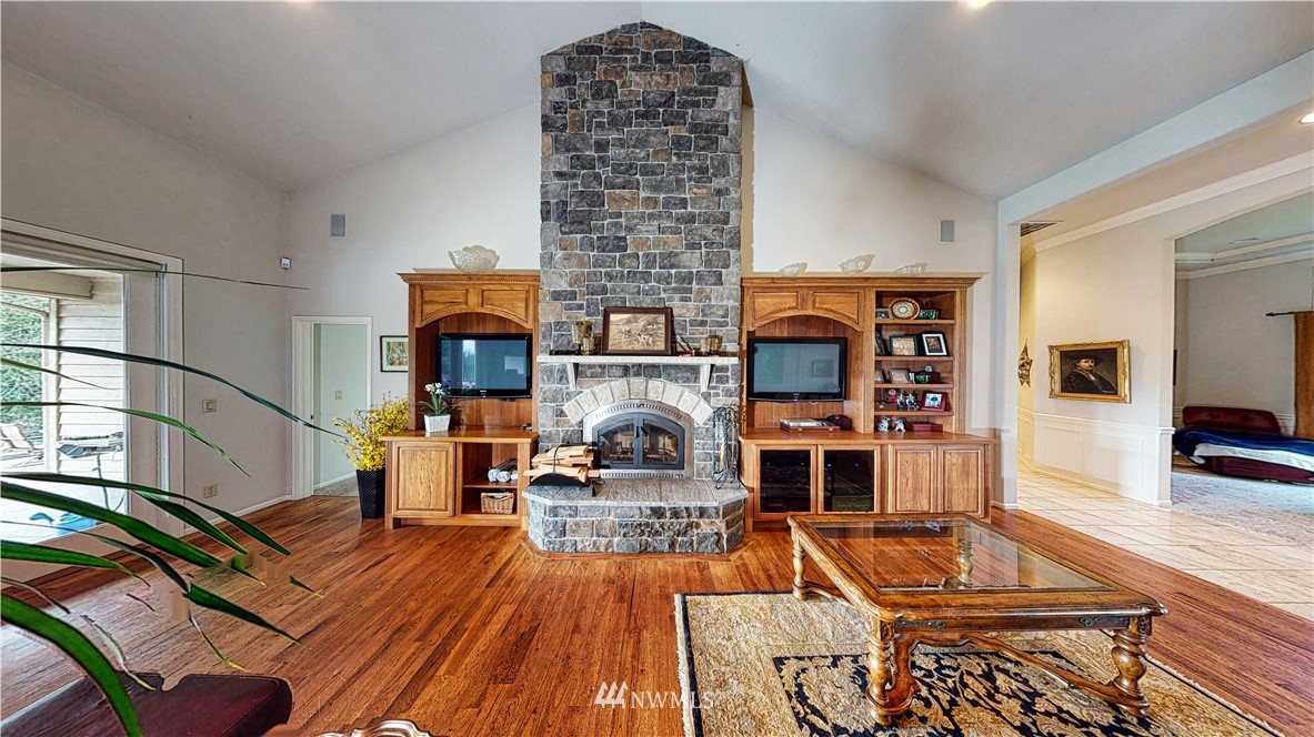 4830 Fobes Road Snohomish, WA 98290 - Photo 12 of 35 a living room with fireplace furniture and a wooden floor