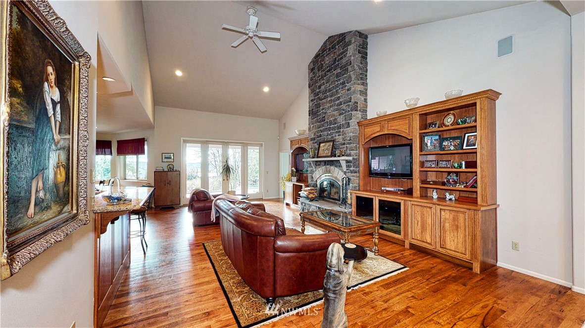 4830 Fobes Road Snohomish, WA 98290 - Photo 13 of 35 a living room with fireplace furniture and a flat screen tv