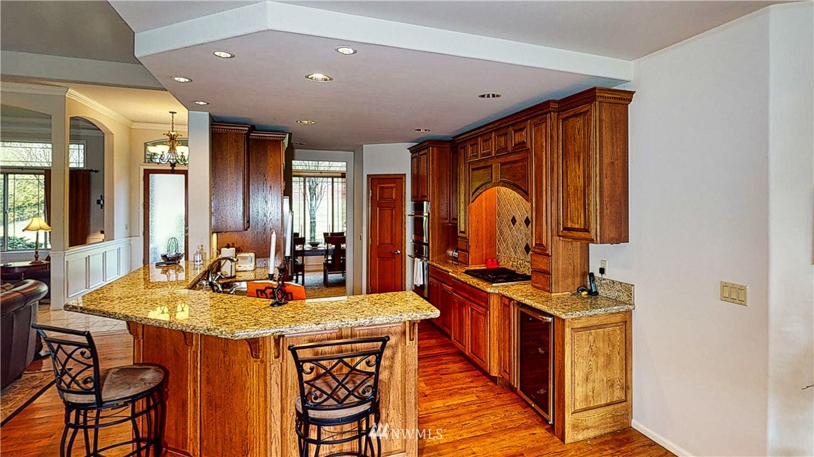 4830 Fobes Road Snohomish, WA 98290 - Photo 18 of 35 a kitchen with stainless steel appliances granite countertop a stove a sink and a refrigerator