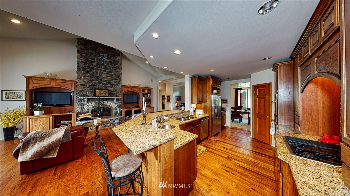 4830 Fobes Road Snohomish, WA 98290 - Photo 20 of 35 a living room with furniture a flat screen tv and a fireplace
