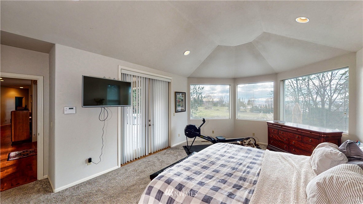 4830 Fobes Road Snohomish, WA 98290 - Photo 25 of 35 a bedroom with a large bed and a flat tv screen