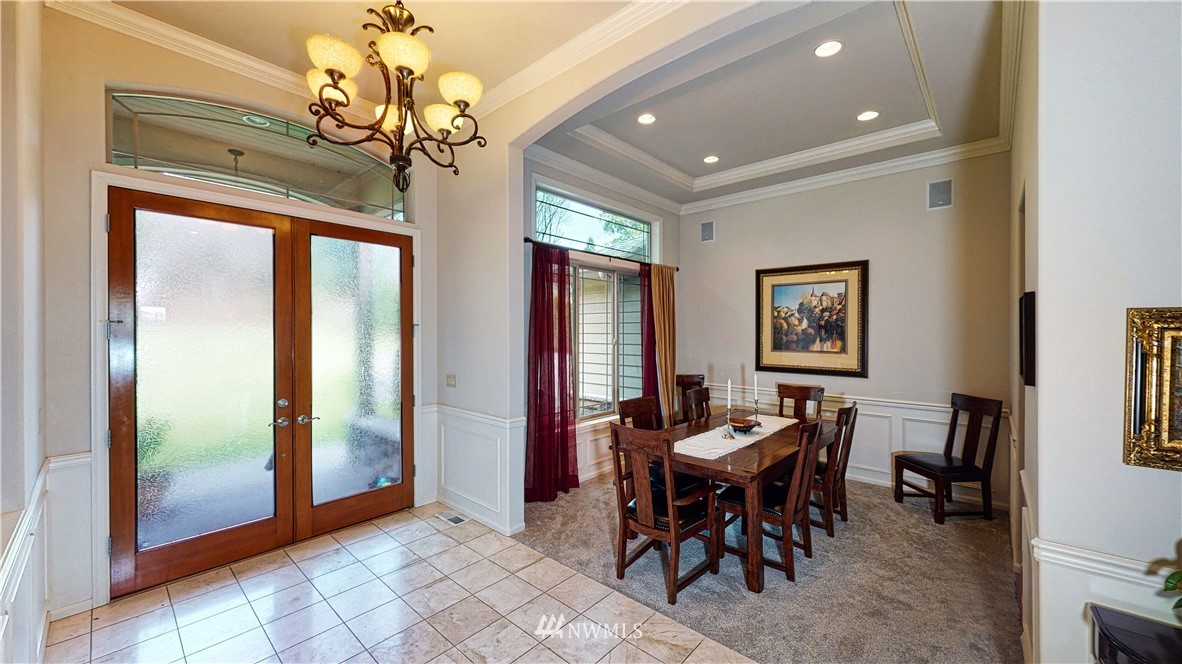 4830 Fobes Road Snohomish, WA 98290 - Photo 9 of 35 a view of a dining room with furniture and a chandelier