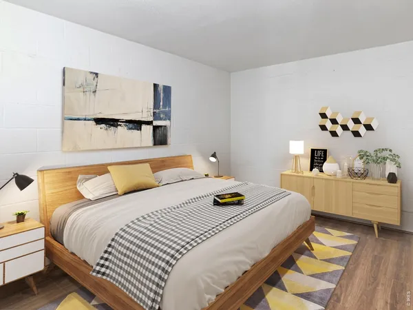 a bedroom with a bed and a dresser