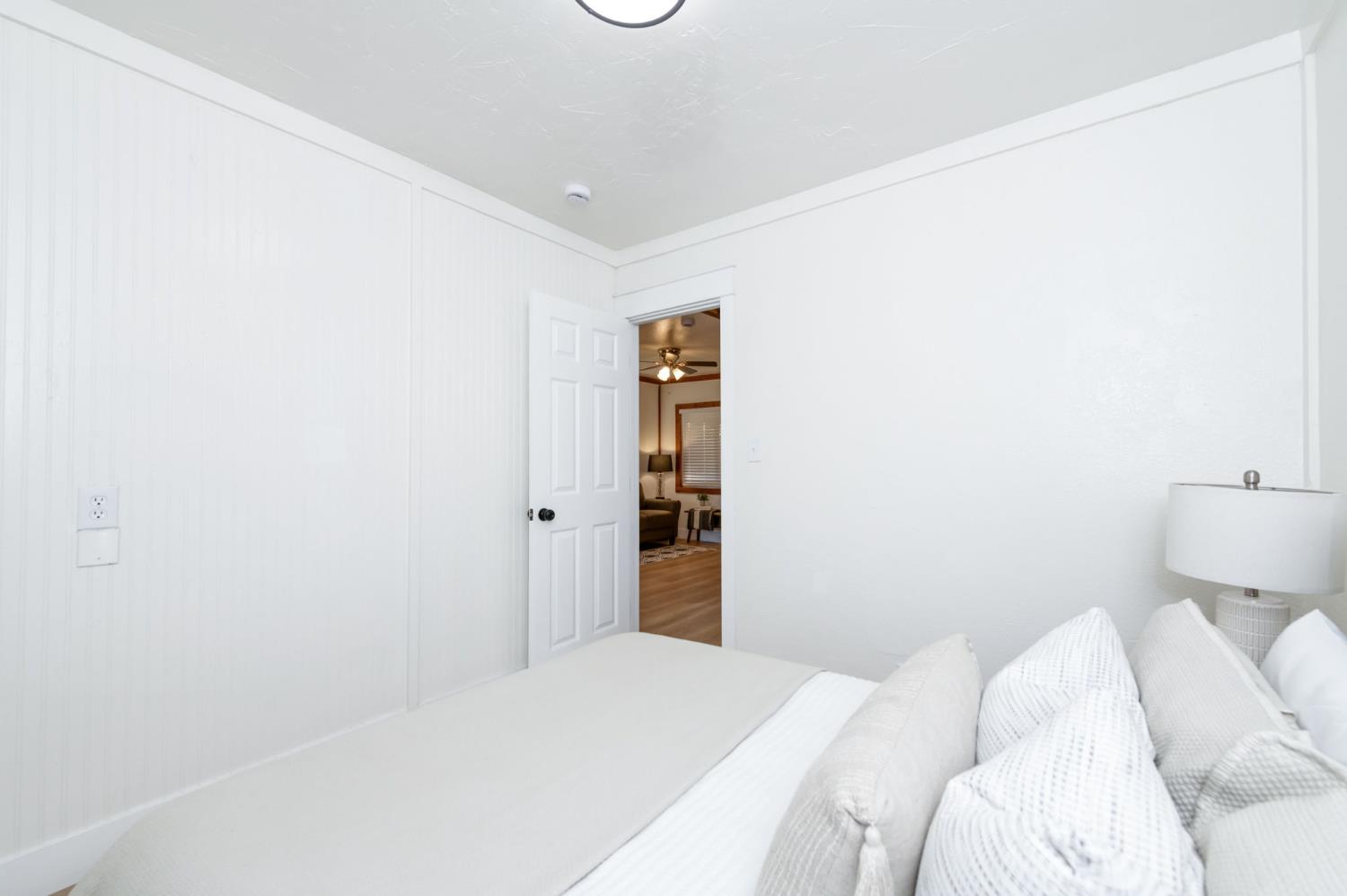 2414 Snyder Street Selma, CA 93662 - Photo 14 of 28 a bedroom with a bed and a toilet