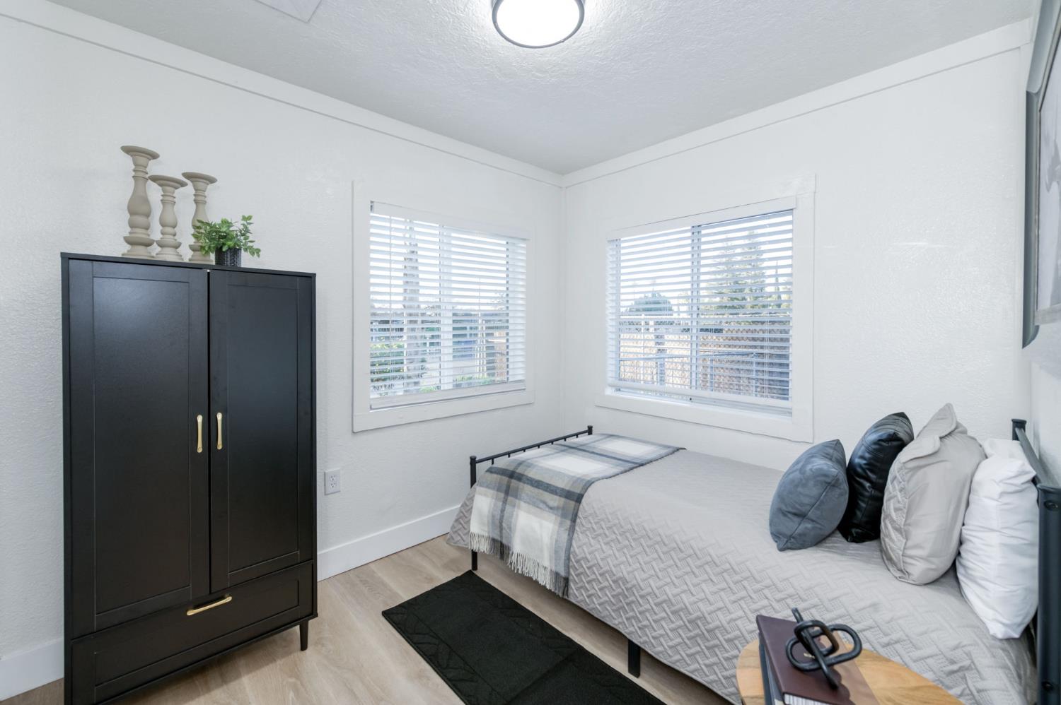 2414 Snyder Street Selma, CA 93662 - Photo 9 of 28 a bedroom with a bed and a window