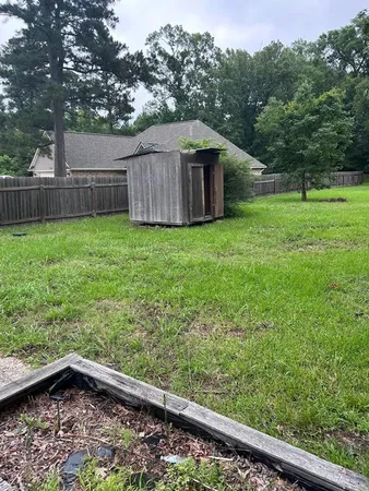 a backyard of a house with lots of green space
