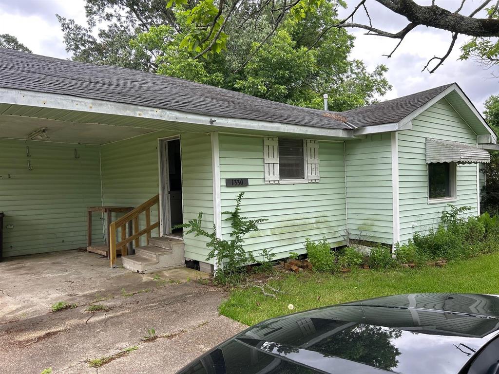 1330 Palmetto Road Benton, LA 71006 - Photo 2 of 13 View of front facade featuring roof with shingles and entry steps
