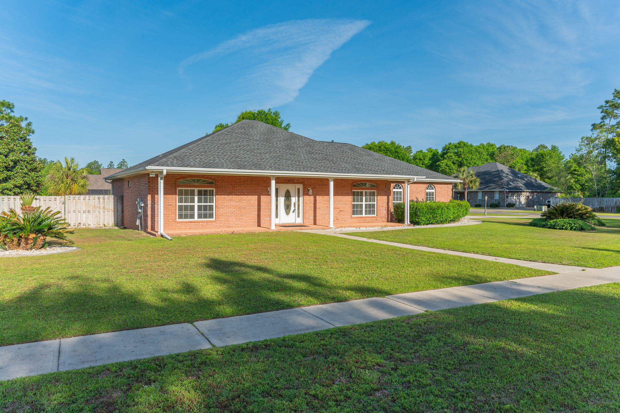 5552 Frontier Drive Crestview, FL 32536 - Photo 4 of 50 a front view of a house with a yard