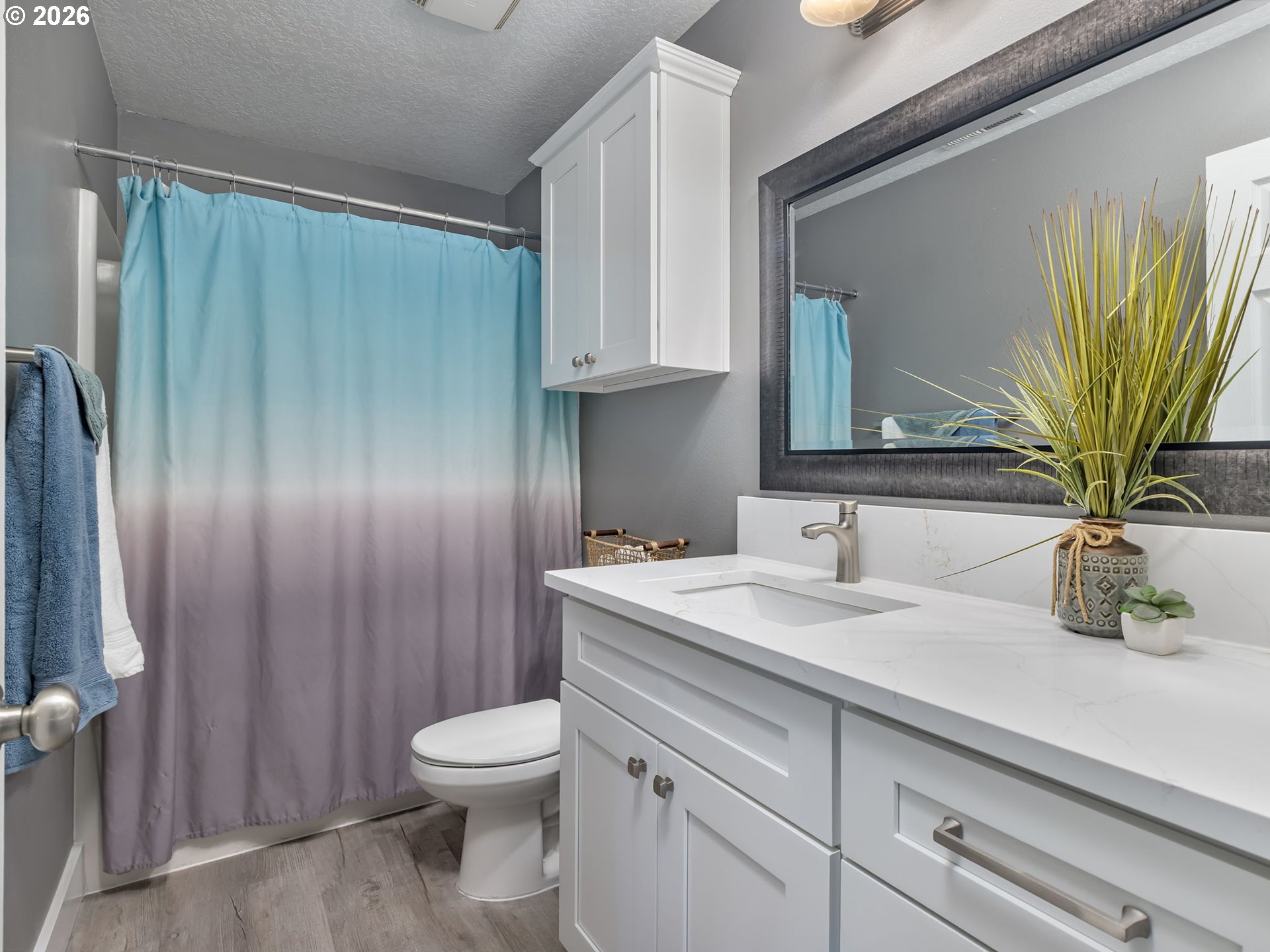 19775 Northeast Trunk Road Dundee, OR 97115 - Photo 27 of 48 a bathroom with a granite countertop sink a toilet and mirror