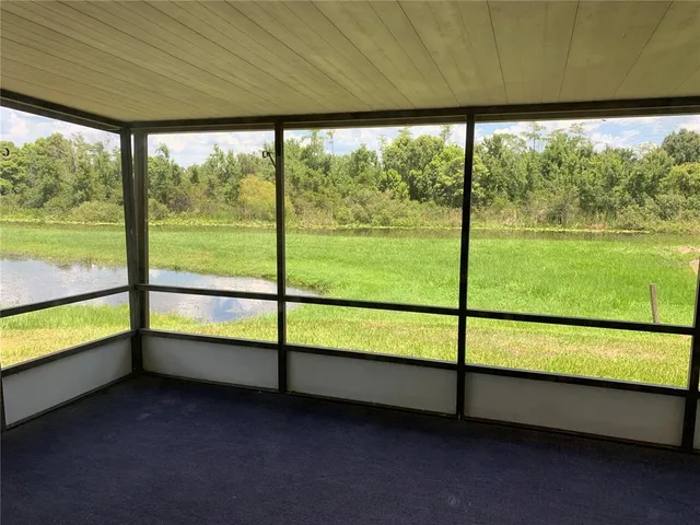 an empty room with a kitchen