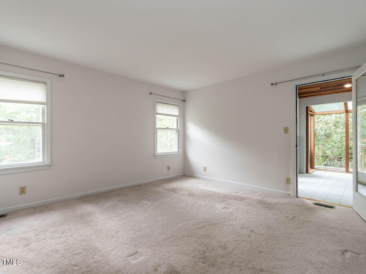 3309 Cobblestone Court Raleigh, NC 27607 - Photo 17 of 38 an empty room with windows