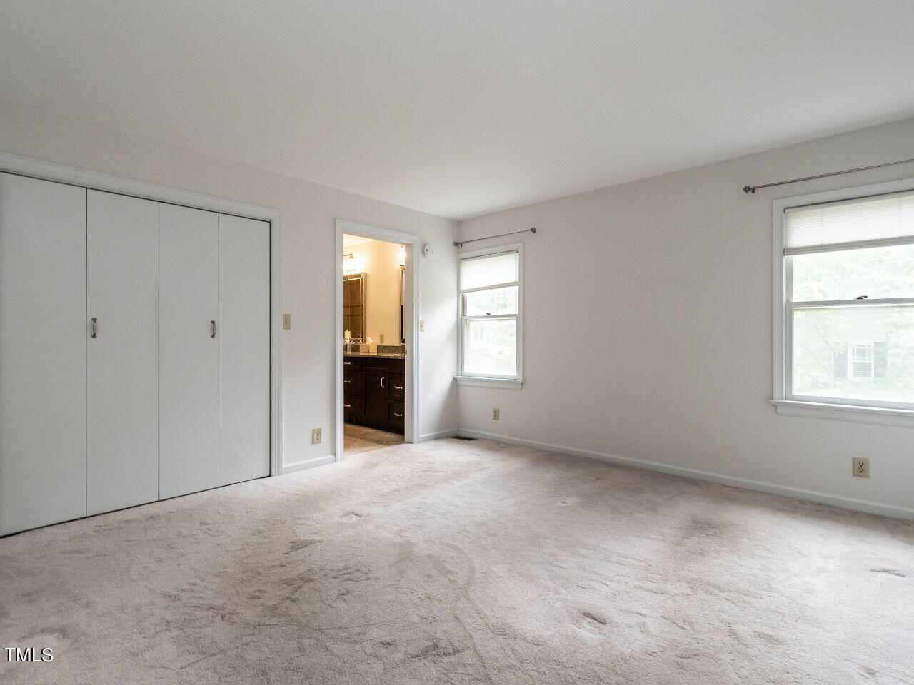 3309 Cobblestone Court Raleigh, NC 27607 - Photo 18 of 38 a view of an empty room with a window