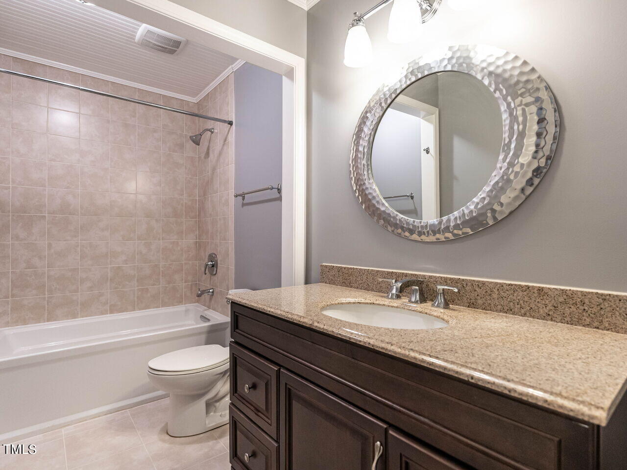 3309 Cobblestone Court Raleigh, NC 27607 - Photo 29 of 38 a bathroom with a toilet a sink and bathtub