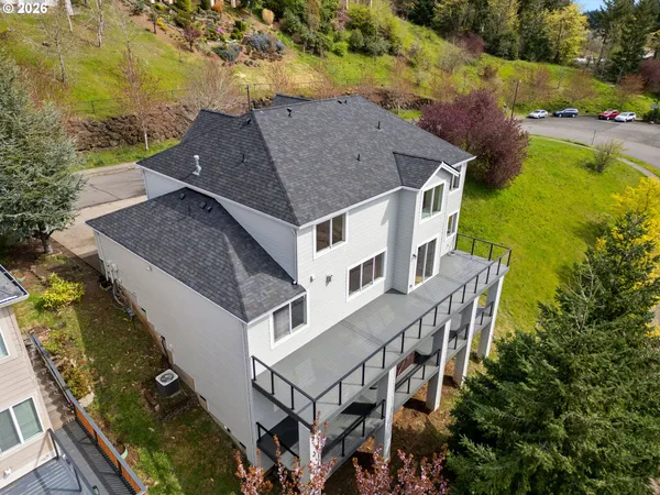 an aerial view of a house with a yard