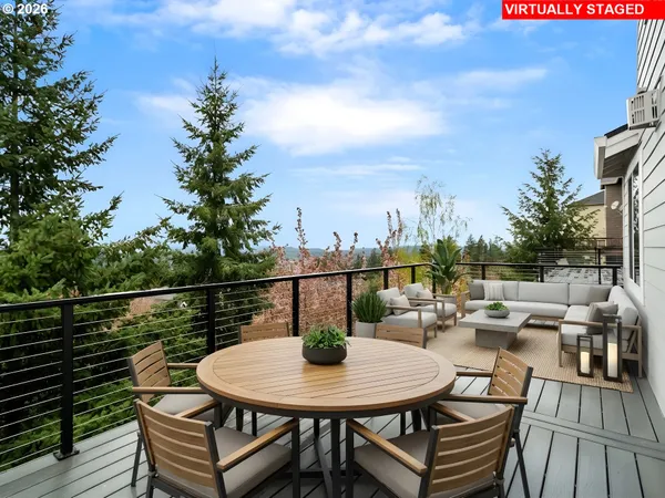a view of a chairs and table in the balcony