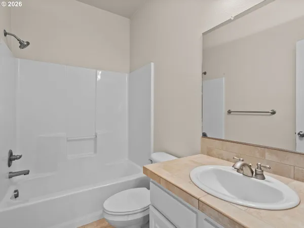 a bathroom with a sink toilet and bathtub