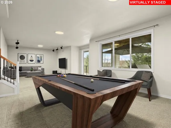 a room with table chairs and flat screen tv