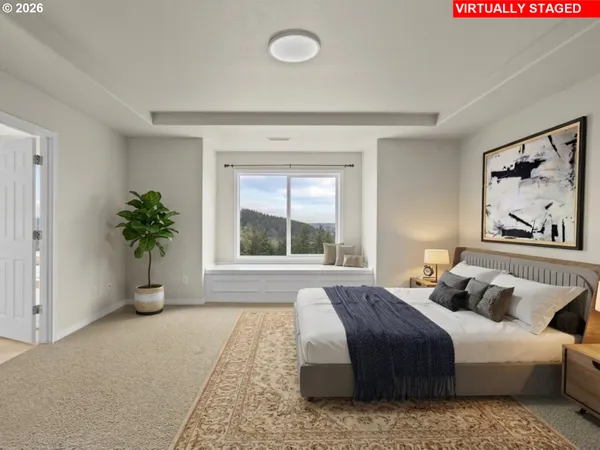 a bedroom with a bed and glass window