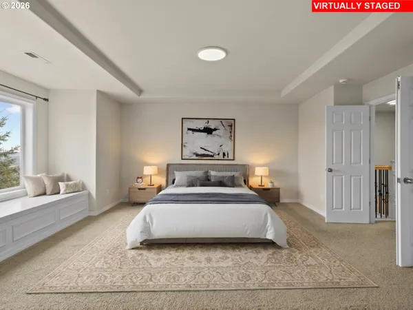 a bedroom with a large bed and a couch