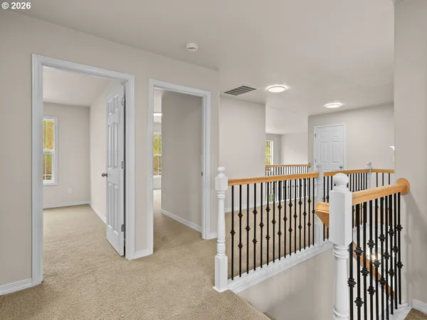 a view of a hallway with entryway door