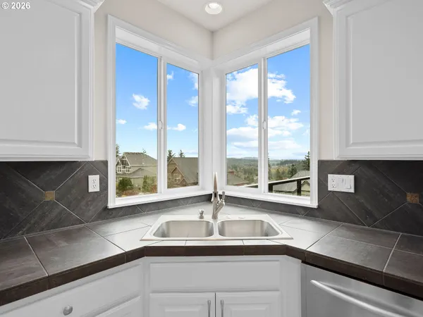 a kitchen with a sink and a window