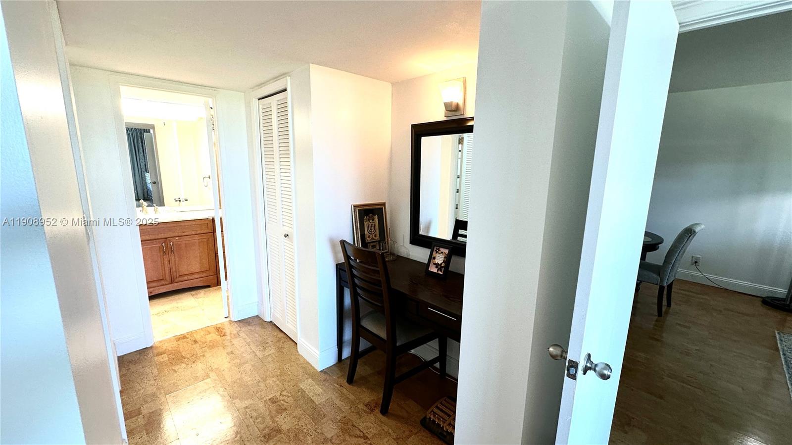 2651 South Course Drive, Unit 307 Pompano Beach, FL 33069 - Photo 18 of 33 a view of a bedroom from a hallway