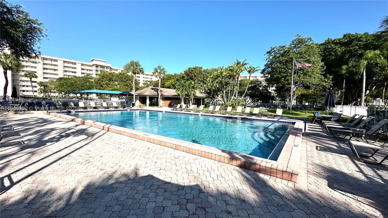 2651 South Course Drive, Unit 307 Pompano Beach, FL 33069 - Photo 25 of 33 a view of a swimming pool with a lake view
