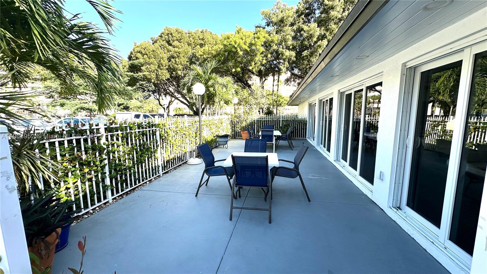 2651 South Course Drive, Unit 307 Pompano Beach, FL 33069 - Photo 32 of 33 a view of a chairs and tables in the balcony