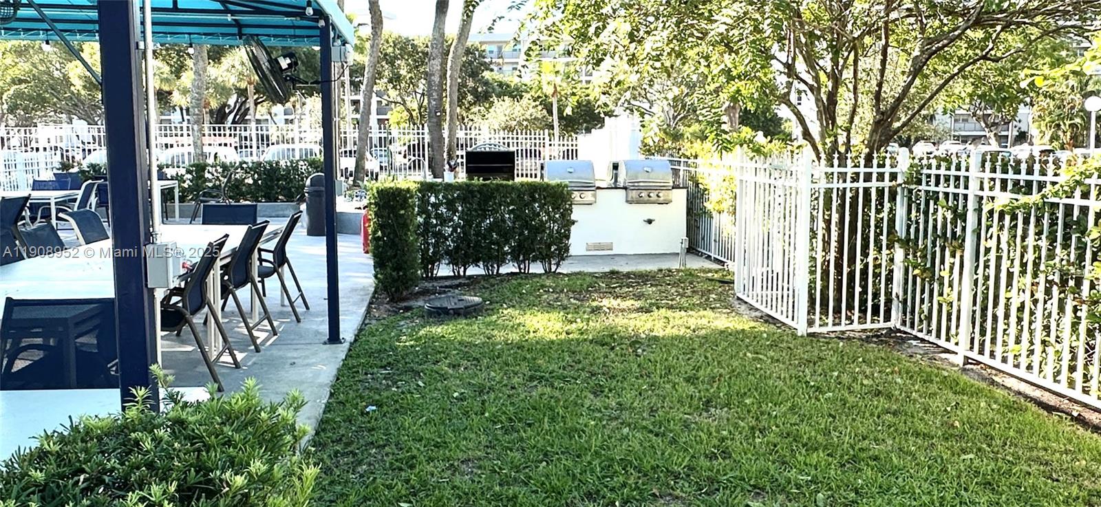 2651 South Course Drive, Unit 307 Pompano Beach, FL 33069 - Photo 33 of 33 a view of a porch with a yard
