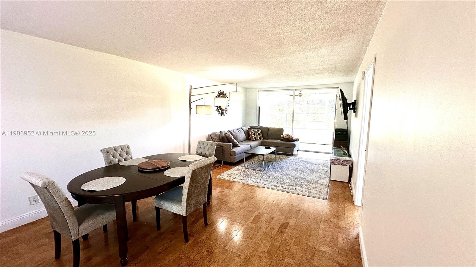 2651 South Course Drive, Unit 307 Pompano Beach, FL 33069 - Photo 8 of 33 a view of a dining room with furniture and a window