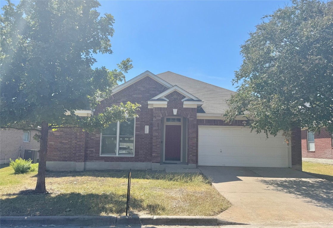 1511 Freestone Drive Pflugerville, TX 78660 - Photo 12 of 12 a view of a house with a snow on the road and a small yard