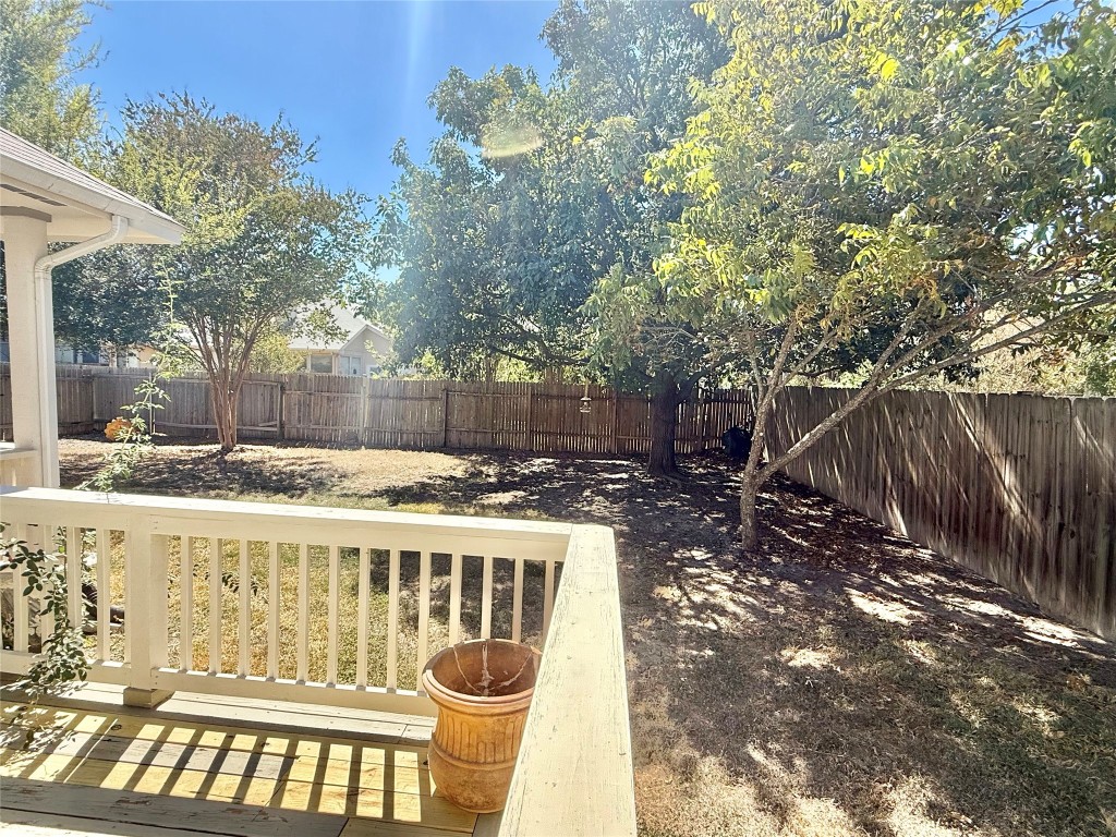 1511 Freestone Drive Pflugerville, TX 78660 - Photo 7 of 12 a view of a chairs and table in the backyard