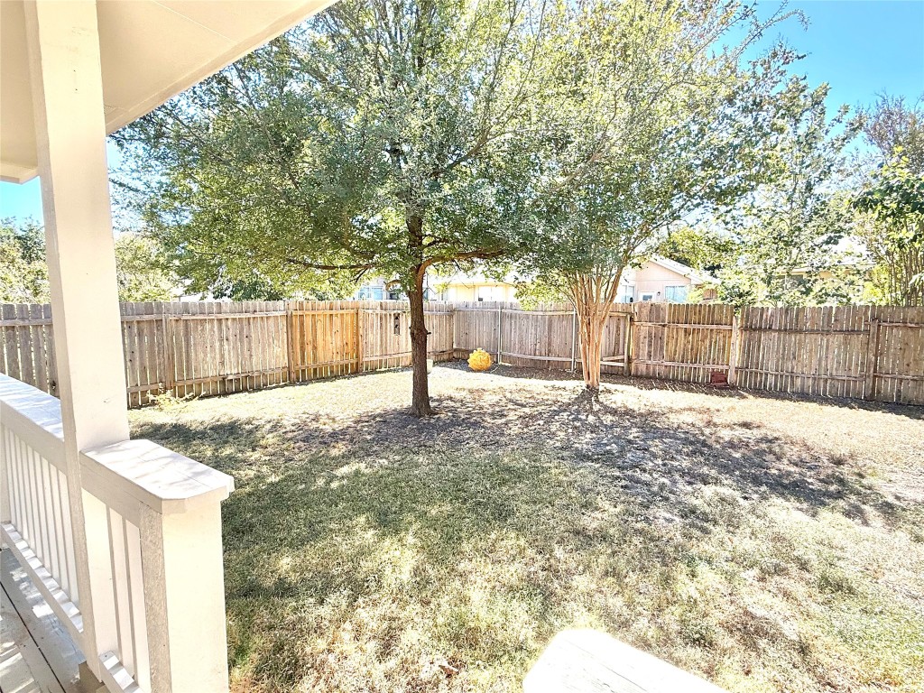 1511 Freestone Drive Pflugerville, TX 78660 - Photo 8 of 12 a house with trees in front of it